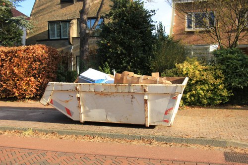 Happy homeowners after successful loft clearance in Hanwell